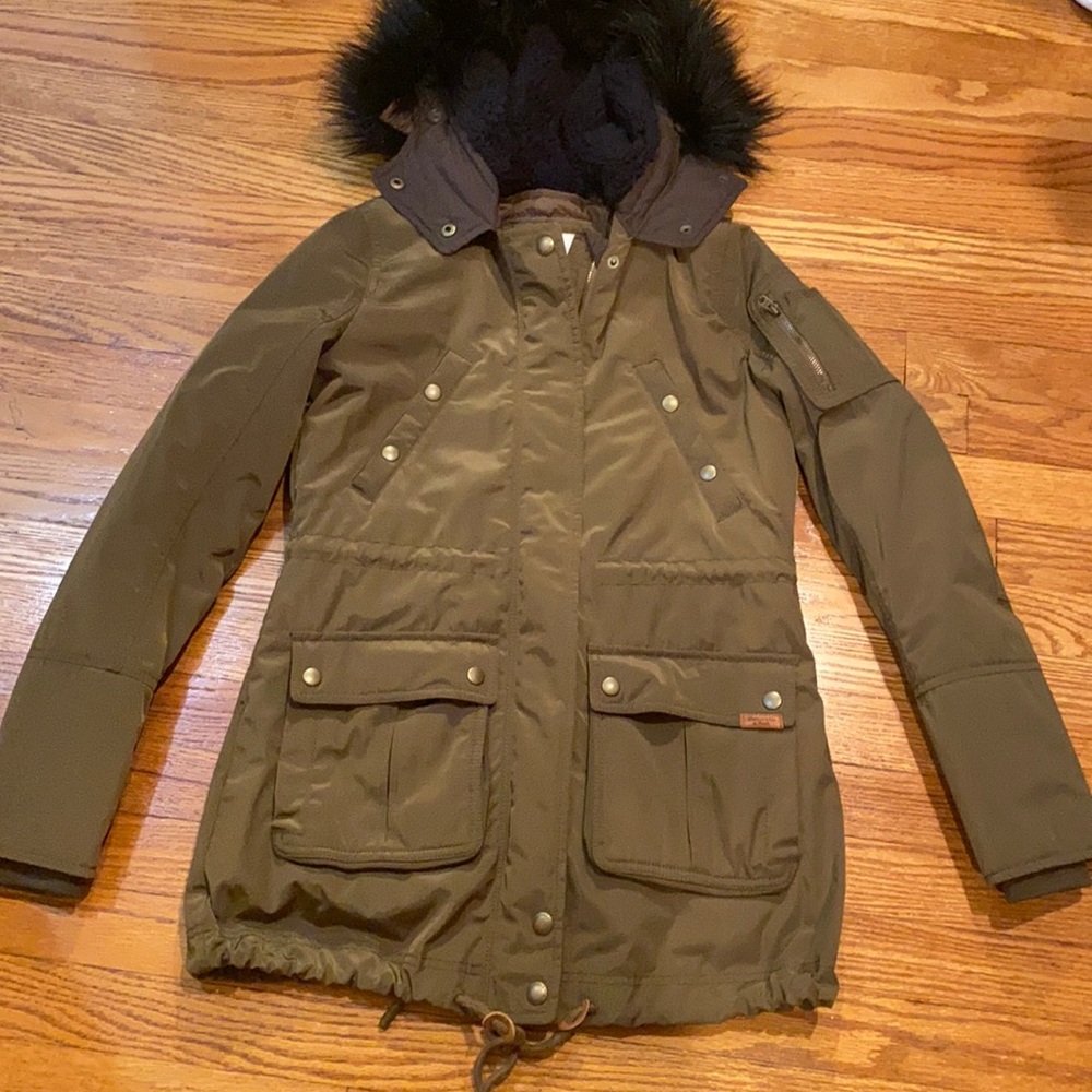 Brand new olive green jacket with removable vest.